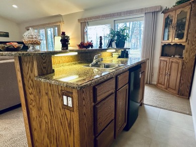 This spacious 4-bedroom, 2-bathroom home offers the best of both on Quest Golf Club in Michigan - for sale on GolfHomes.com, golf home, golf lot