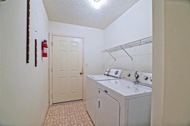 Priced Below Market--Investor or Handyman Special! This split on The Links of Spruce Creek in Florida - for sale on GolfHomes.com, golf home, golf lot