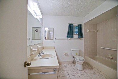 Priced Below Market--Investor or Handyman Special! This split on The Links of Spruce Creek in Florida - for sale on GolfHomes.com, golf home, golf lot