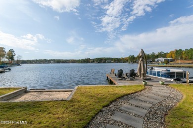 Enjoy luxurious lake front living at its finest in this on Beacon Ridge Golf and Country Club in North Carolina - for sale on GolfHomes.com, golf home, golf lot