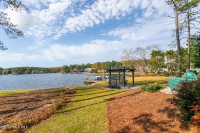 Enjoy luxurious lake front living at its finest in this on Beacon Ridge Golf and Country Club in North Carolina - for sale on GolfHomes.com, golf home, golf lot