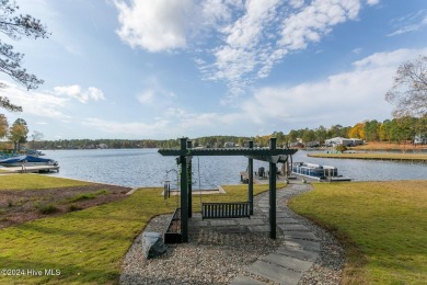 Enjoy luxurious lake front living at its finest in this on Beacon Ridge Golf and Country Club in North Carolina - for sale on GolfHomes.com, golf home, golf lot