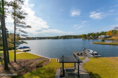 Enjoy luxurious lake front living at its finest in this on Beacon Ridge Golf and Country Club in North Carolina - for sale on GolfHomes.com, golf home, golf lot