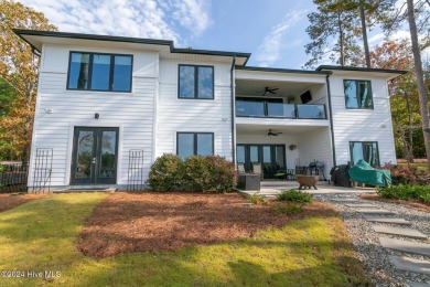 Enjoy luxurious lake front living at its finest in this on Beacon Ridge Golf and Country Club in North Carolina - for sale on GolfHomes.com, golf home, golf lot