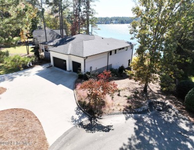 Enjoy luxurious lake front living at its finest in this on Beacon Ridge Golf and Country Club in North Carolina - for sale on GolfHomes.com, golf home, golf lot