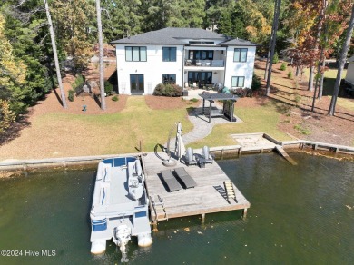 Enjoy luxurious lake front living at its finest in this on Beacon Ridge Golf and Country Club in North Carolina - for sale on GolfHomes.com, golf home, golf lot