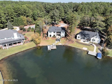 Enjoy luxurious lake front living at its finest in this on Beacon Ridge Golf and Country Club in North Carolina - for sale on GolfHomes.com, golf home, golf lot