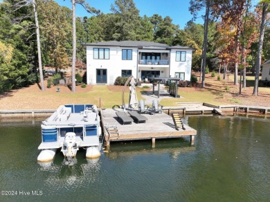 Enjoy luxurious lake front living at its finest in this on Beacon Ridge Golf and Country Club in North Carolina - for sale on GolfHomes.com, golf home, golf lot