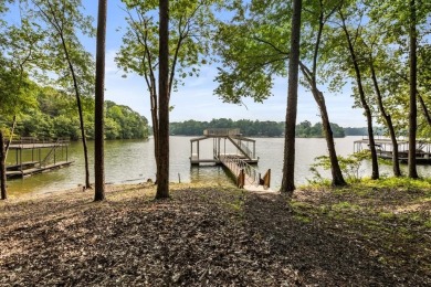 Discover your dream lake retreat on Lake Lanier with this on Crystal Falls Golf Club in Georgia - for sale on GolfHomes.com, golf home, golf lot