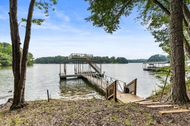 Discover your dream lake retreat on Lake Lanier with this on Crystal Falls Golf Club in Georgia - for sale on GolfHomes.com, golf home, golf lot