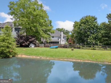 Charming Two-Story Traditional with Private Pond Access on The Golf Club At Bradshaw Farm in Georgia - for sale on GolfHomes.com, golf home, golf lot