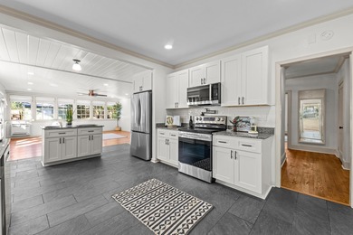 Discover timeless elegance in this 1941 masterpiece overlooking on Capital City Country Club in Florida - for sale on GolfHomes.com, golf home, golf lot