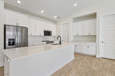 This new construction, move in ready home has it all, a rare on Royal Tee Country Club in Florida - for sale on GolfHomes.com, golf home, golf lot