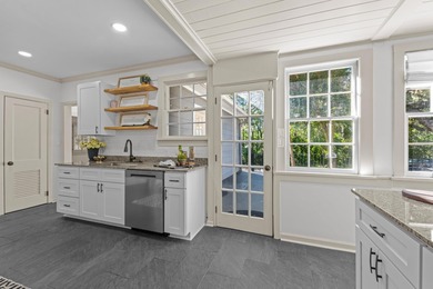 Discover timeless elegance in this 1941 masterpiece overlooking on Capital City Country Club in Florida - for sale on GolfHomes.com, golf home, golf lot