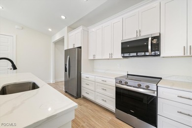 This new construction, move in ready home has it all, a rare on Royal Tee Country Club in Florida - for sale on GolfHomes.com, golf home, golf lot