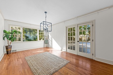 Discover timeless elegance in this 1941 masterpiece overlooking on Capital City Country Club in Florida - for sale on GolfHomes.com, golf home, golf lot