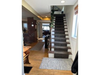 This 3-story home is conveniently located near downtown Bangor on Bangor Municipal Golf Course in Maine - for sale on GolfHomes.com, golf home, golf lot