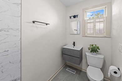 Discover timeless elegance in this 1941 masterpiece overlooking on Capital City Country Club in Florida - for sale on GolfHomes.com, golf home, golf lot