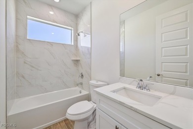 This new construction, move in ready home has it all, a rare on Royal Tee Country Club in Florida - for sale on GolfHomes.com, golf home, golf lot