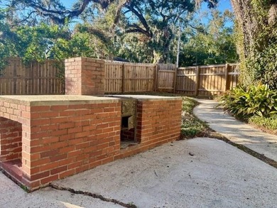 Discover timeless elegance in this 1941 masterpiece overlooking on Capital City Country Club in Florida - for sale on GolfHomes.com, golf home, golf lot