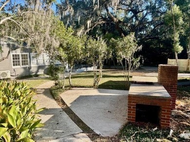 Discover timeless elegance in this 1941 masterpiece overlooking on Capital City Country Club in Florida - for sale on GolfHomes.com, golf home, golf lot