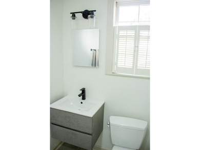 Discover timeless elegance in this 1941 masterpiece overlooking on Capital City Country Club in Florida - for sale on GolfHomes.com, golf home, golf lot