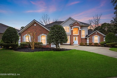 Tucked beneath mature oaks in the gated golf course community of on The Palencia Club in Florida - for sale on GolfHomes.com, golf home, golf lot