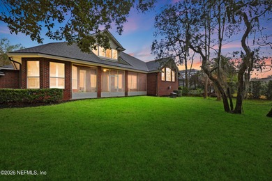 Tucked beneath mature oaks in the gated golf course community of on The Palencia Club in Florida - for sale on GolfHomes.com, golf home, golf lot