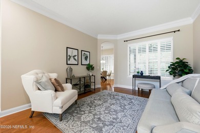 Tucked beneath mature oaks in the gated golf course community of on The Palencia Club in Florida - for sale on GolfHomes.com, golf home, golf lot