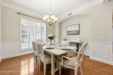 Tucked beneath mature oaks in the gated golf course community of on The Palencia Club in Florida - for sale on GolfHomes.com, golf home, golf lot