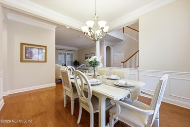 Tucked beneath mature oaks in the gated golf course community of on The Palencia Club in Florida - for sale on GolfHomes.com, golf home, golf lot