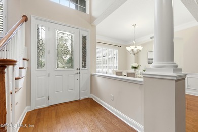 Tucked beneath mature oaks in the gated golf course community of on The Palencia Club in Florida - for sale on GolfHomes.com, golf home, golf lot