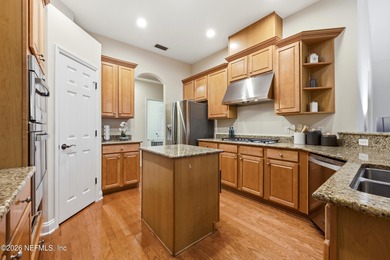 Tucked beneath mature oaks in the gated golf course community of on The Palencia Club in Florida - for sale on GolfHomes.com, golf home, golf lot