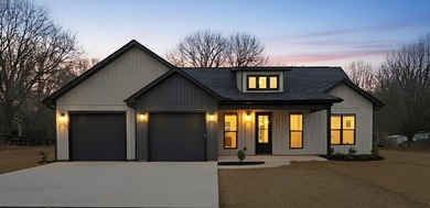 You can't miss this eye-catching new build right off Highway 357 on Woodfin Ridge Golf Club in South Carolina - for sale on GolfHomes.com, golf home, golf lot