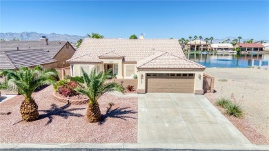 Welcome to your waterfront retreat in the highly sought-after on Los Lagos Golf Club in Arizona - for sale on GolfHomes.com, golf home, golf lot