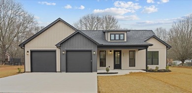 You can't miss this eye-catching new build right off Highway 357 on Woodfin Ridge Golf Club in South Carolina - for sale on GolfHomes.com, golf home, golf lot