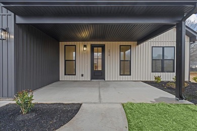 You can't miss this eye-catching new build right off Highway 357 on Woodfin Ridge Golf Club in South Carolina - for sale on GolfHomes.com, golf home, golf lot