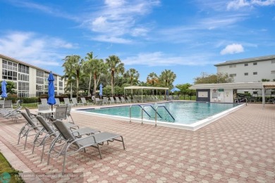 FULLY UPDATED UNIT BOASTING FULL IMPACT WINDOWS, DOORS & PATIO! on Wynmoor Golf Course in Florida - for sale on GolfHomes.com, golf home, golf lot
