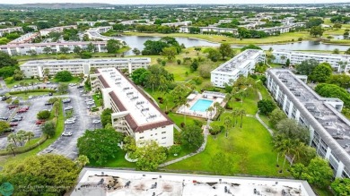 FULLY UPDATED UNIT BOASTING FULL IMPACT WINDOWS, DOORS & PATIO! on Wynmoor Golf Course in Florida - for sale on GolfHomes.com, golf home, golf lot
