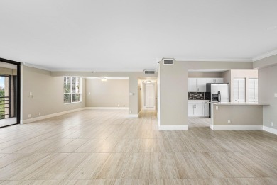 Discover this stunning condo with breathtaking lake and golf on Boca Pointe Country Club in Florida - for sale on GolfHomes.com, golf home, golf lot