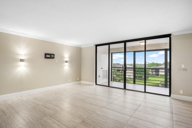 Discover this stunning condo with breathtaking lake and golf on Boca Pointe Country Club in Florida - for sale on GolfHomes.com, golf home, golf lot