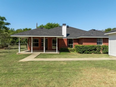 This beautifully maintained brick home is in a quite tree-shaded on White Bluff Resort - New Course in Texas - for sale on GolfHomes.com, golf home, golf lot