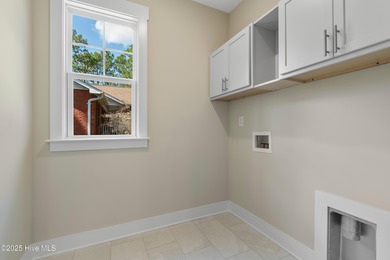 This exceptional new lakefront home by Langbeen Builders, Inc on The Lakes Country Club in North Carolina - for sale on GolfHomes.com, golf home, golf lot