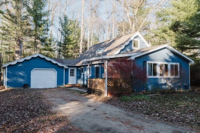 Discover the perfect retreat in this cozy chalet, ideally on Burning Oak Country Club in Michigan - for sale on GolfHomes.com, golf home, golf lot