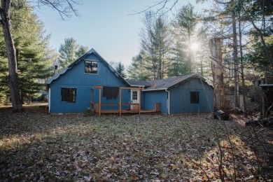 Discover the perfect retreat in this cozy chalet, ideally on Burning Oak Country Club in Michigan - for sale on GolfHomes.com, golf home, golf lot