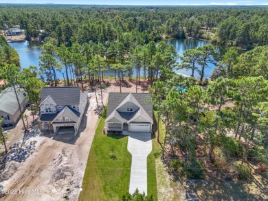 This exceptional new lakefront home by Langbeen Builders, Inc on The Lakes Country Club in North Carolina - for sale on GolfHomes.com, golf home, golf lot