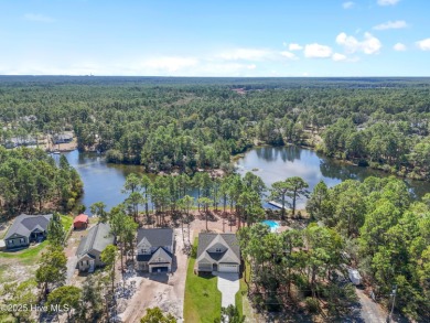 This exceptional new lakefront home by Langbeen Builders, Inc on The Lakes Country Club in North Carolina - for sale on GolfHomes.com, golf home, golf lot