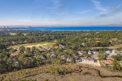 This distinguished custom-built residence is situated within the on Sandestin Golf and Beach Resort - Raven in Florida - for sale on GolfHomes.com, golf home, golf lot