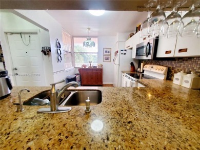 MUST SEE! Beautifully remodeled 2nd floor 2/2 condo in an active on Sunrise Lakes Phase IV Golf Course in Florida - for sale on GolfHomes.com, golf home, golf lot