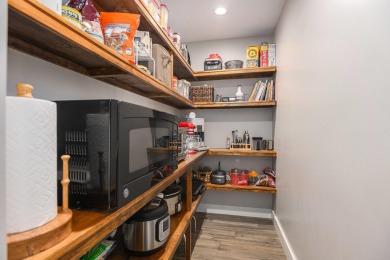 Introducing an exceptional Westwood home, perfectly poised on on Grand Prairie Golf Course in Michigan - for sale on GolfHomes.com, golf home, golf lot